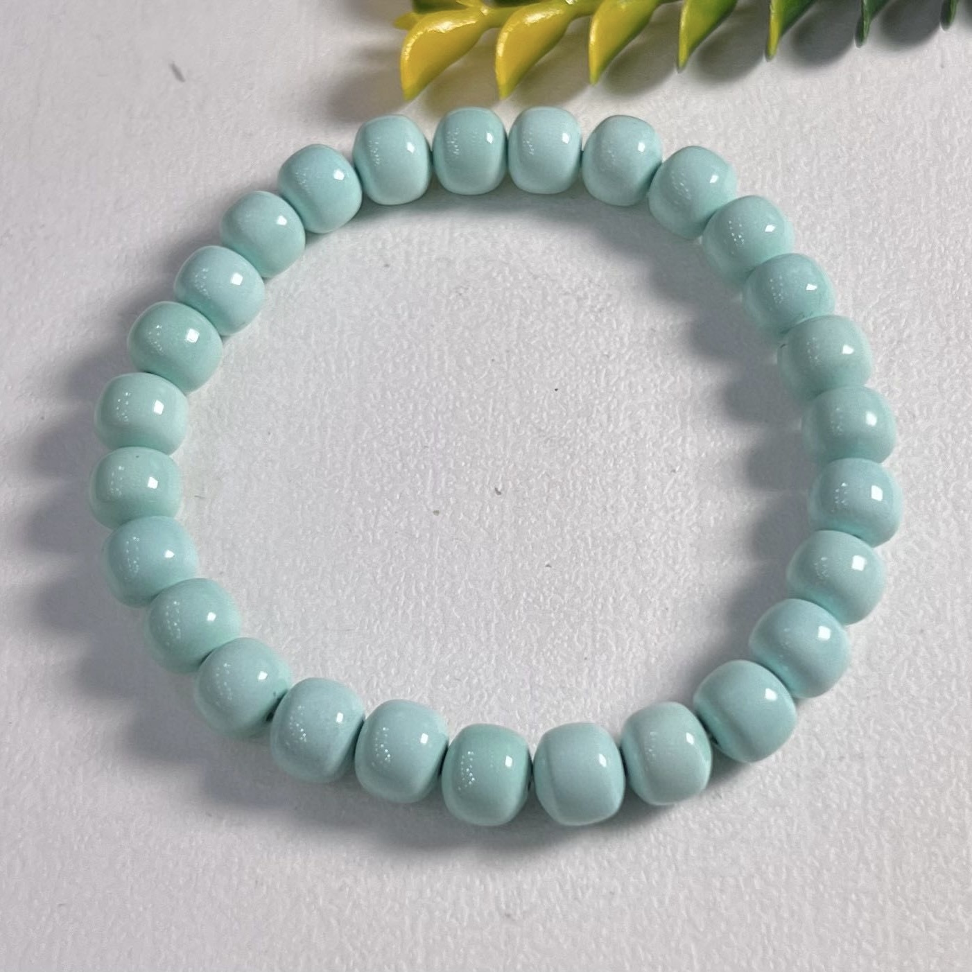 高瓷浅蓝色绿松石老形珠单圈手串