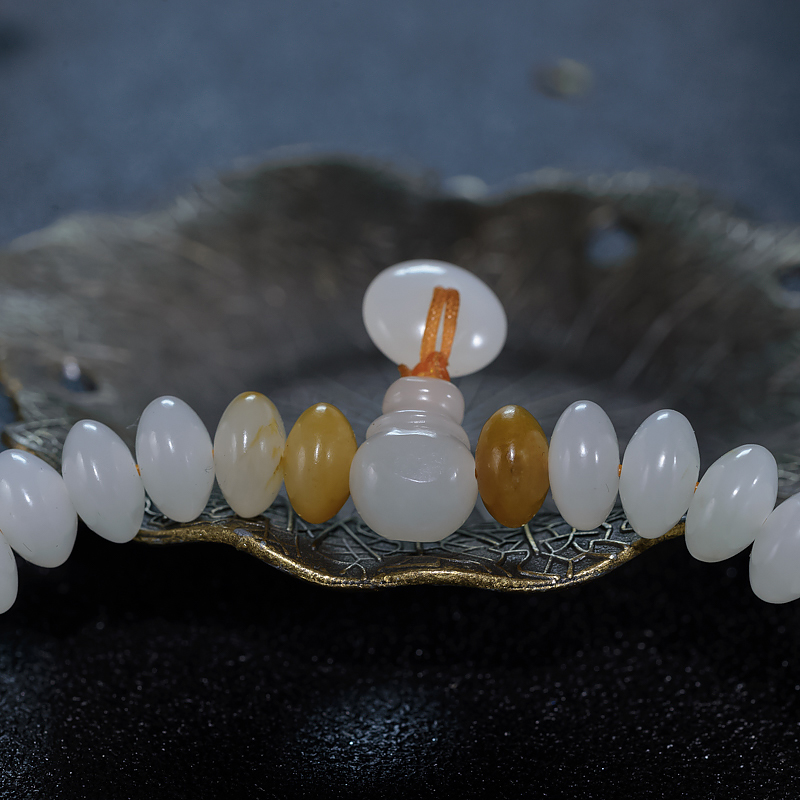 新疆天然籽料和田白玉手持-红掌柜