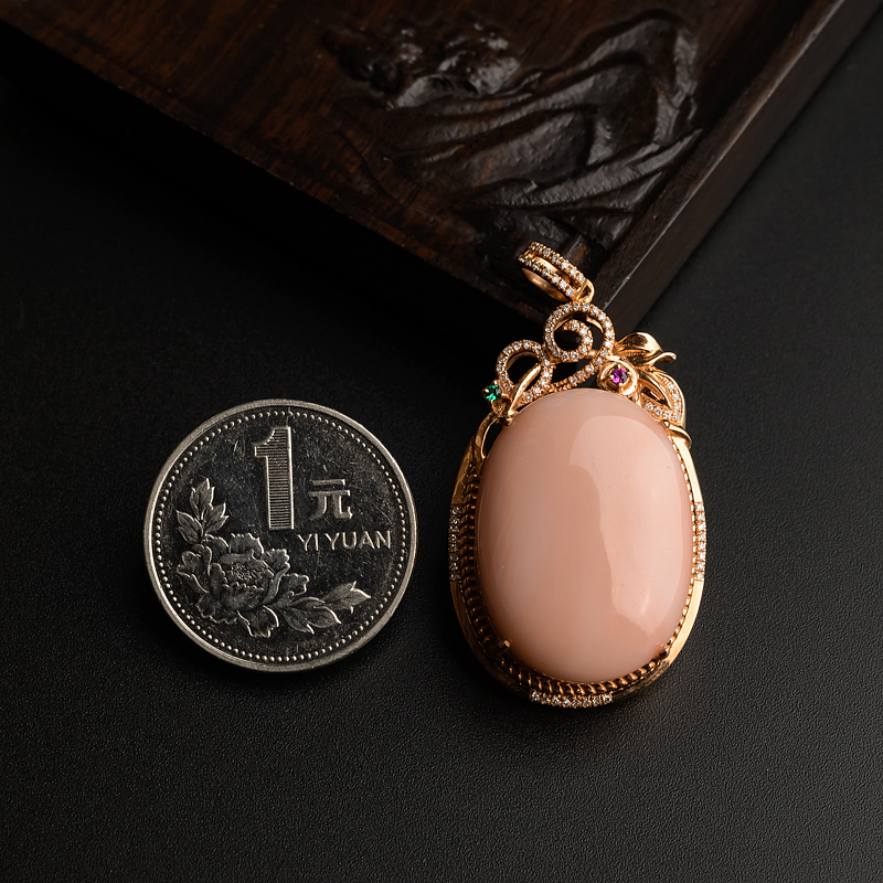 天然孩儿面珊瑚吊坠-红掌柜