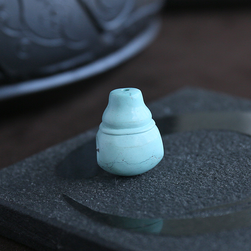 高瓷绿松石佛头-红掌柜