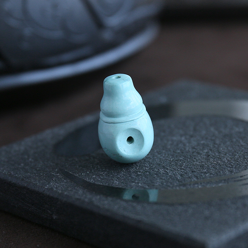 高瓷绿松石佛头-红掌柜