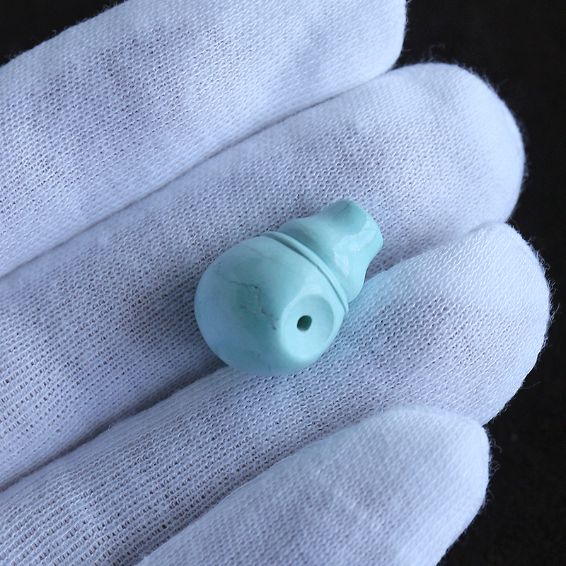 高瓷绿松石佛头-红掌柜