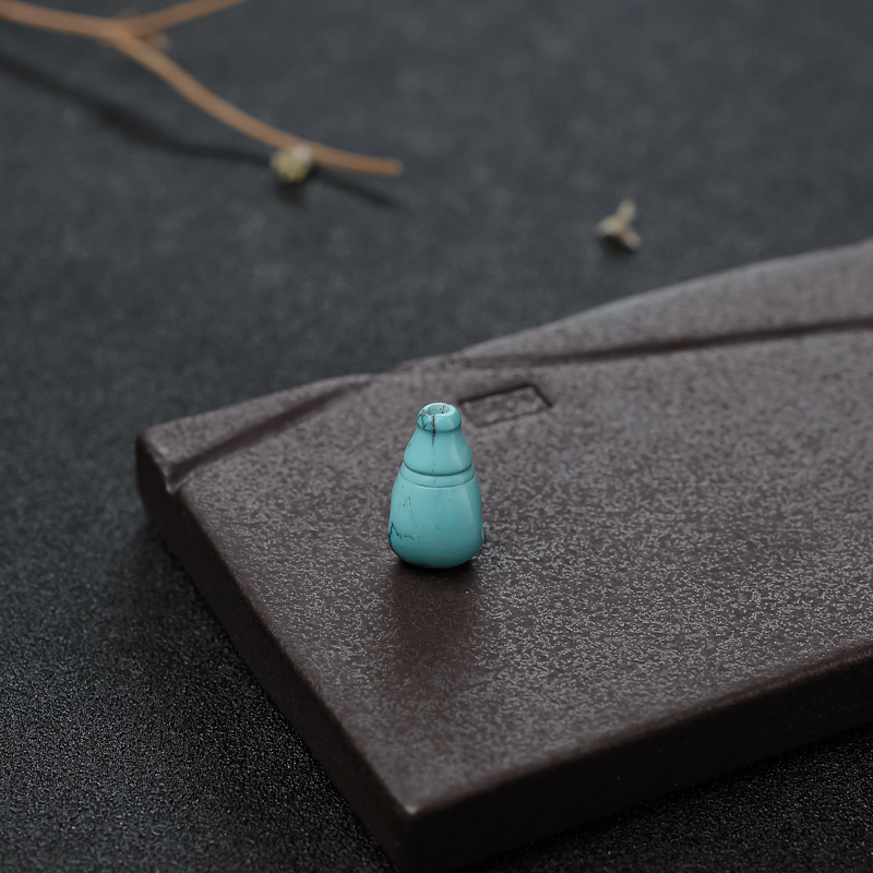 高瓷铁线松石佛头三通-红掌柜