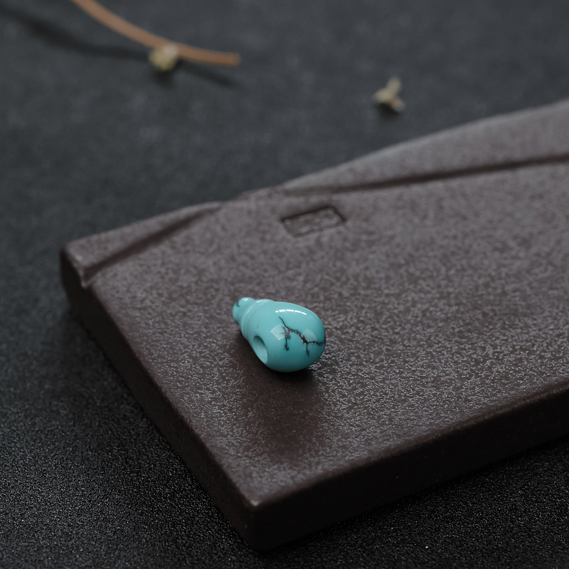 高瓷绿松石佛头三通-红掌柜