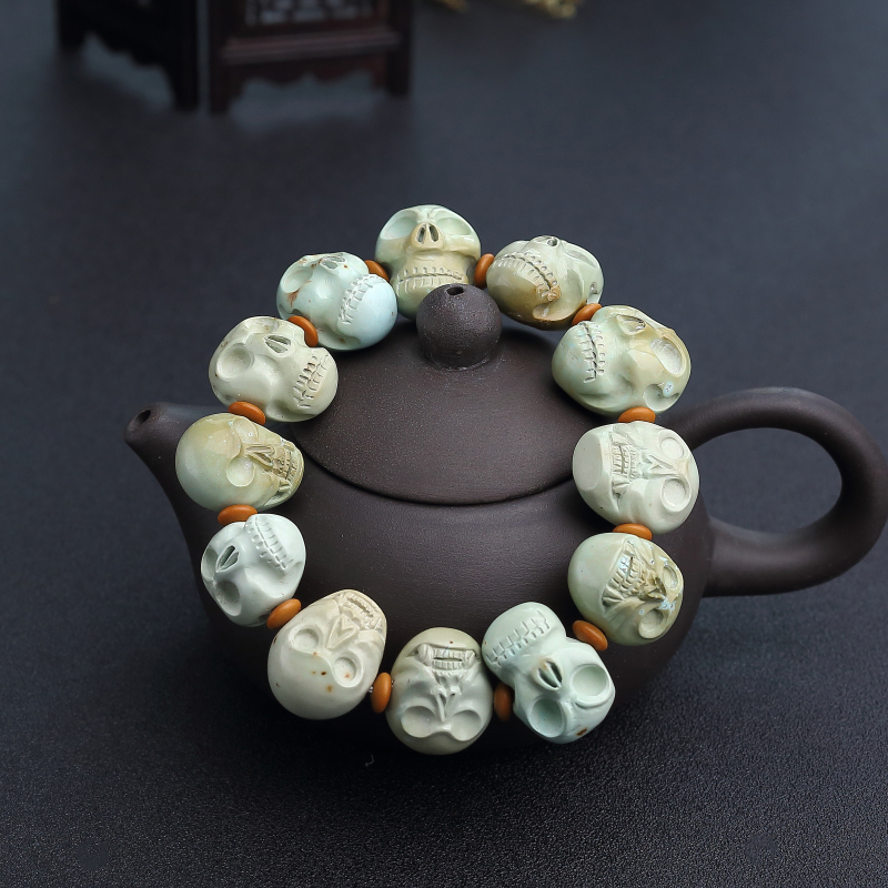 高瓷铁线俏色绿松石骷髅头单圈手串-红掌柜