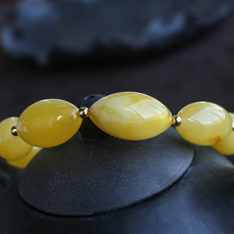 鸡油黄蜜蜡橄榄珠手串-红掌柜