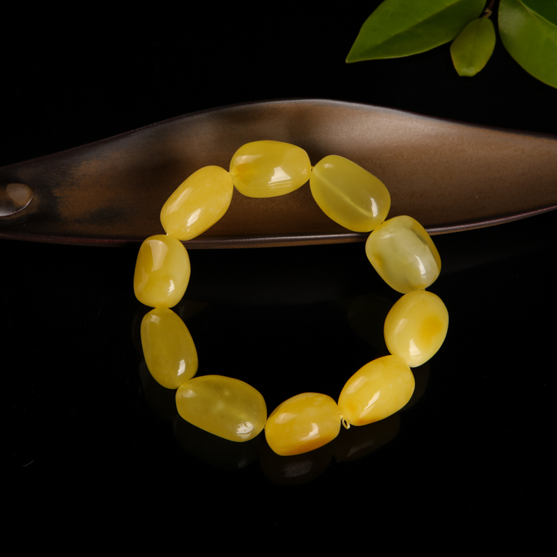 带皮鸡油黄蜜蜡随形单圈手串-红掌柜