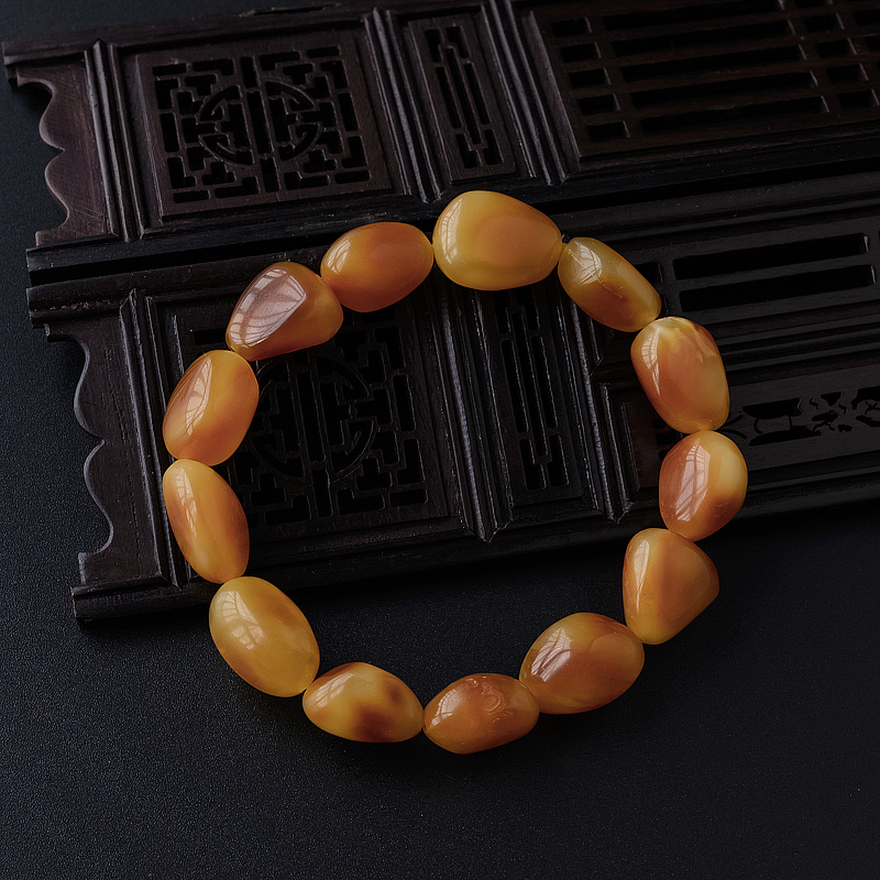 鸡油红随形蜜蜡手串 - 红掌柜