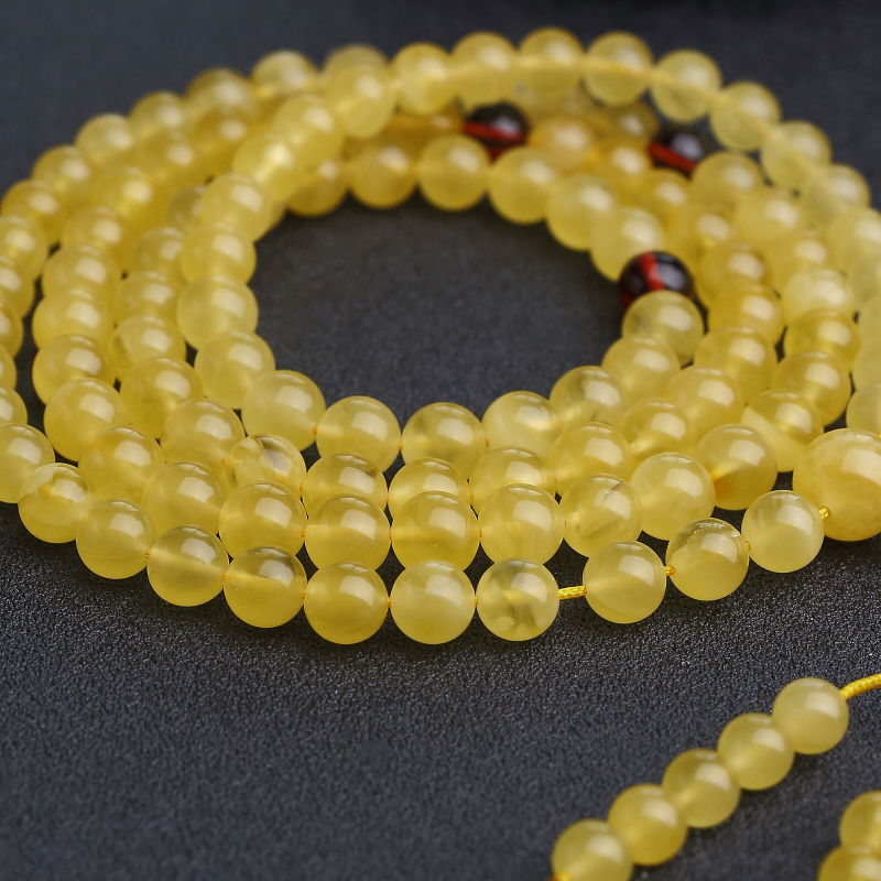 波罗的海天然鸡油黄金绞蜜佛珠-红掌柜