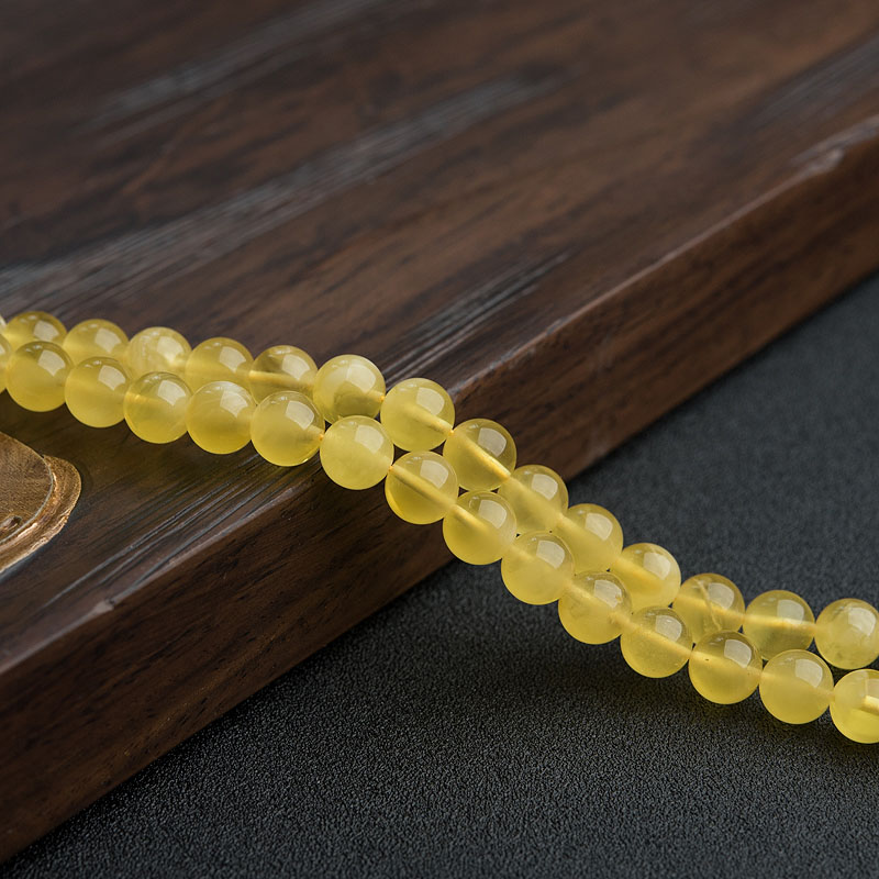 8mm鸡油黄金绞蜜佛珠-红掌柜