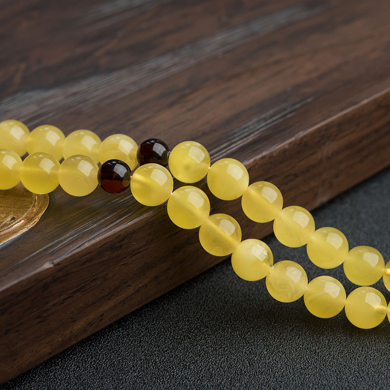 9mm鸡油黄金绞蜜佛珠-红掌柜