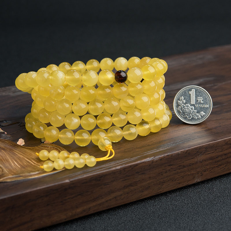 天然金绞蜜佛珠-红掌柜