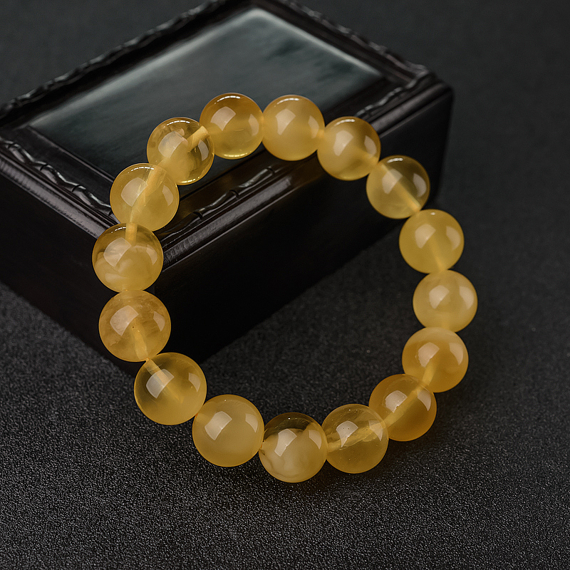 12.5mm鸡油黄金绞蜜手串-红掌柜