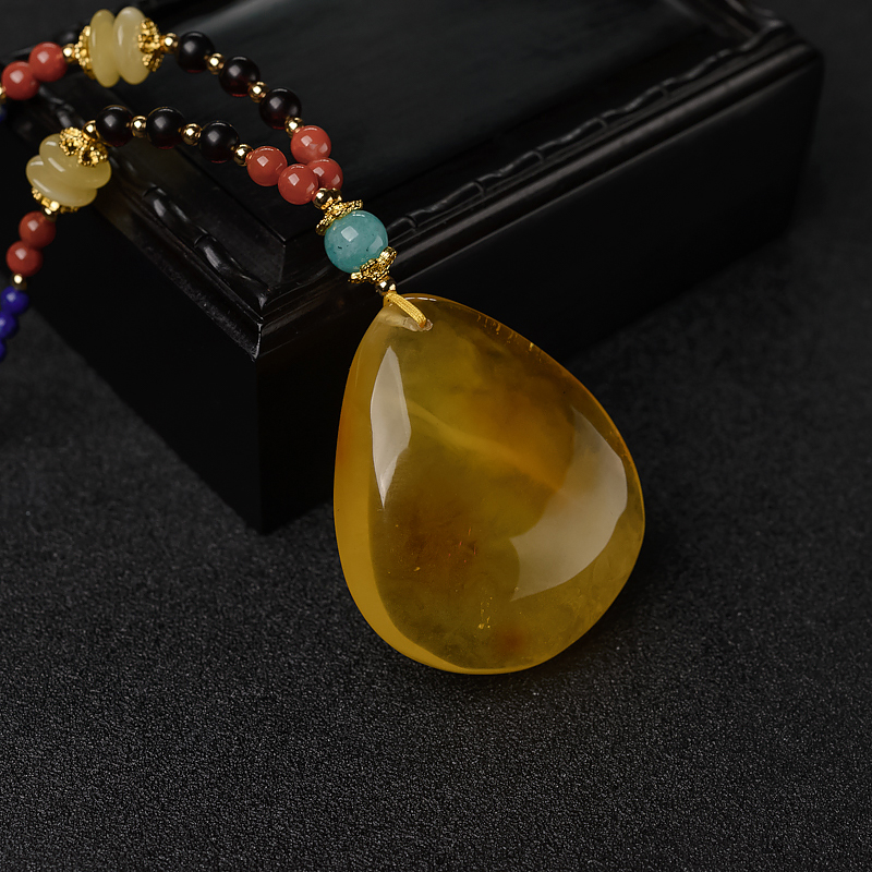 俏色金绞蜜吊坠-红掌柜