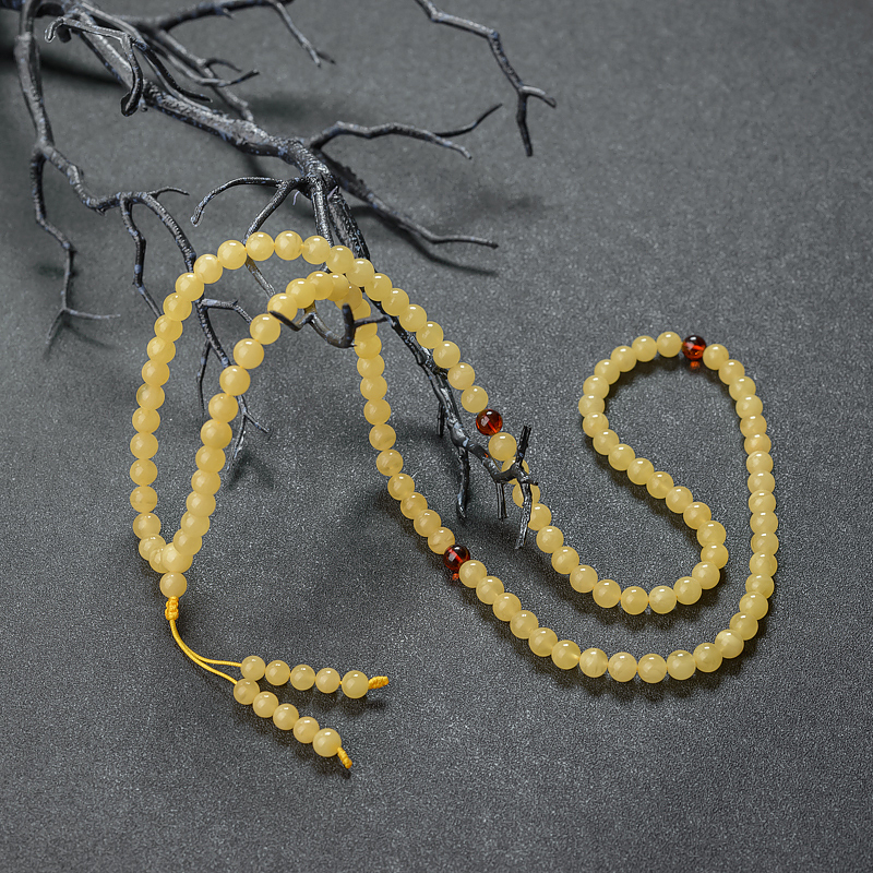 7mm鸡油黄金绞蜜佛珠-红掌柜