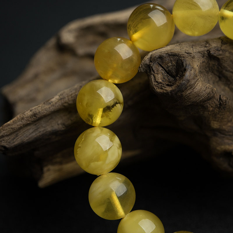 天然波罗的海鸡油黄金绞蜜手串-红掌柜