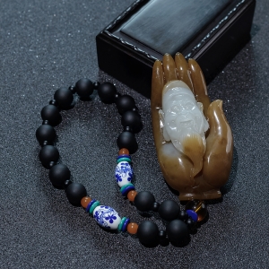 山料俏色和田玉伸手有财手把件