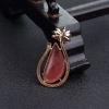 18K金镶钻阿根廷红纹石随形吊坠-红掌柜