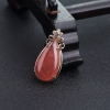 18K金镶钻天然红纹石水滴吊坠-红掌柜