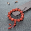 16mm柿子红南红雕花圆珠单圈手串-红掌柜